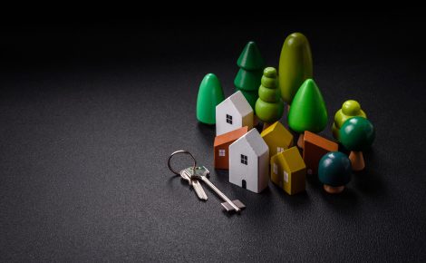 a small wooden house and keys as an idea for investing in your o
