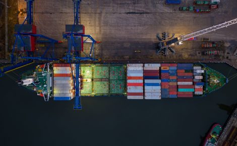 aerial drone view of large car cargo ship entering the port in varna