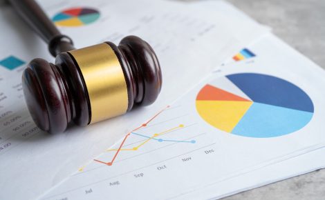 court hammer on chart or graph paper. financial, account, statis