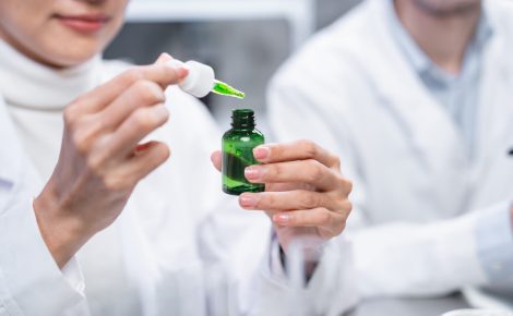 medicine chemical research with organic nature herbal plant in laboratory, cosmetic extract liquid