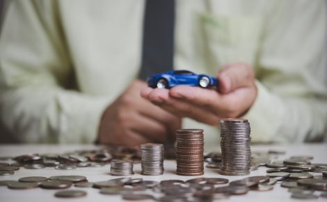 plan finances investments and savings cars.money coin and car on table business accounting and tax and insurance concept.