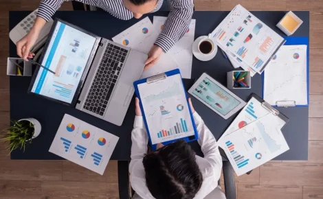 top viewtop view manager employee doing teamwork business office looking charts laptop display 1024x768